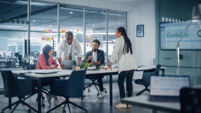 Team collaborating in a modern office meeting room.