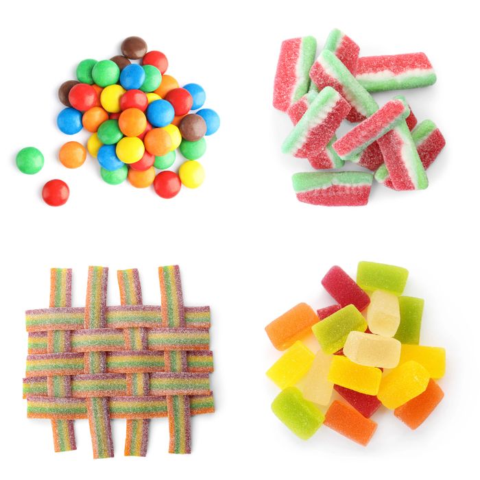 Four types of colorful candies arranged separately on a white background.