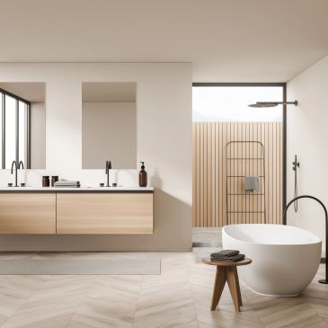 Modern bathroom with freestanding tub and double vanity.