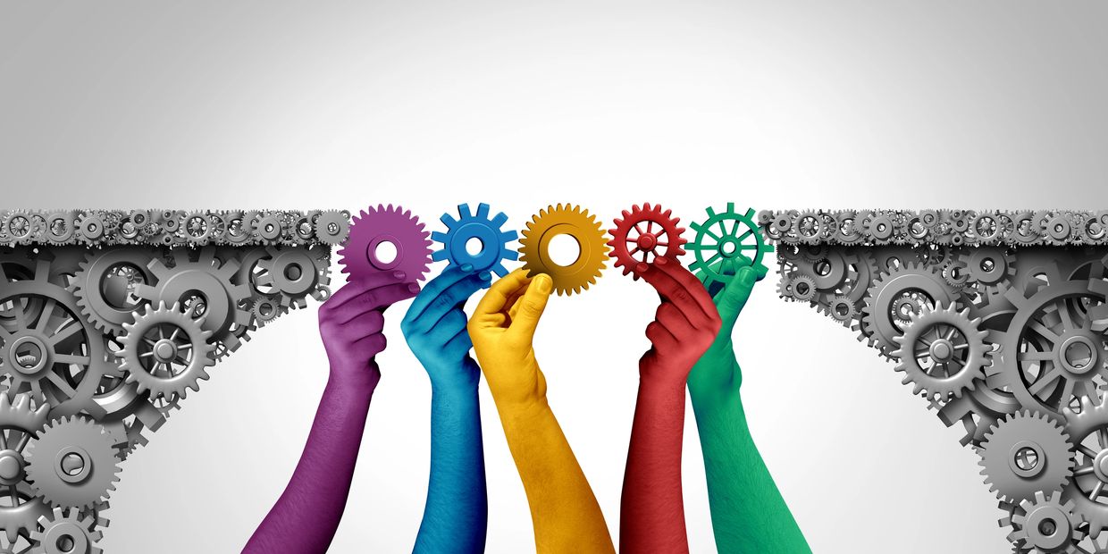 Colorful hands holding gears to connect a organizational health, executive advising and leadership development