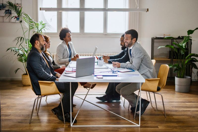 Group of businesspeople sitting together in a meeting
