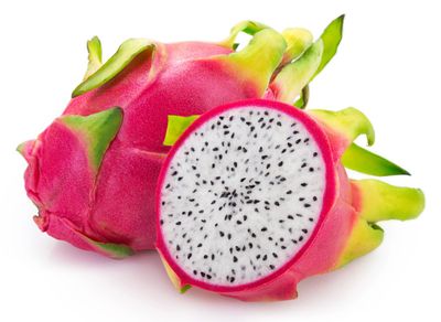 Fresh dragon fruit with vibrant pink skin and white flesh speckled with black seeds.
