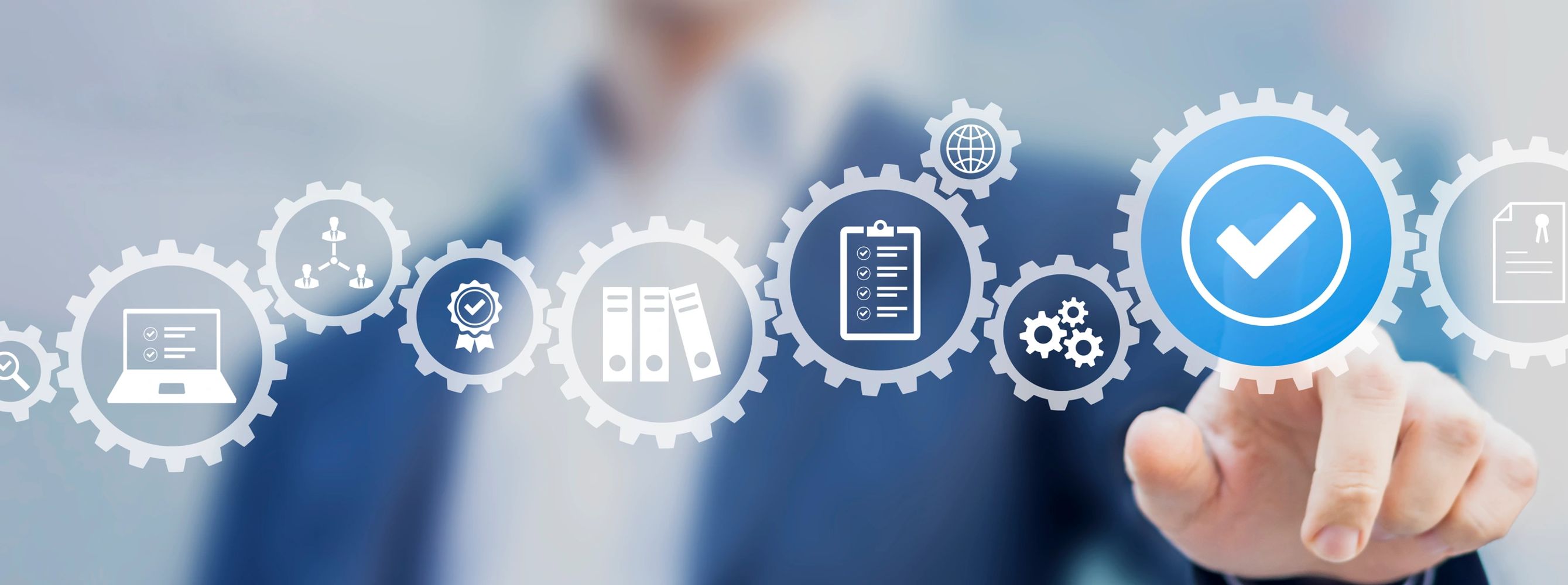 Businessman interacting with digital quality assurance icons in a modern interface.