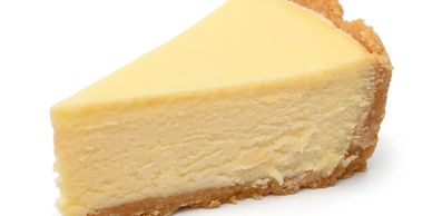A creamy slice of classic cheesecake with a graham cracker crust.