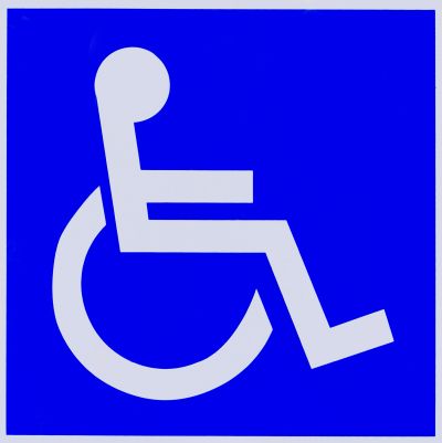 Accessible wheelchair symbol on blue background.