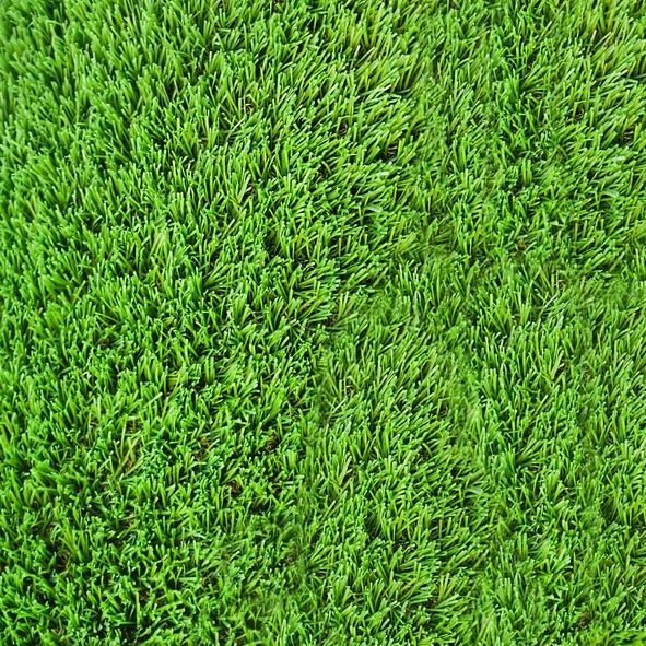 Green grass background. Lawn, football field, green grass artificial turf, texture, top view. summer lawn background