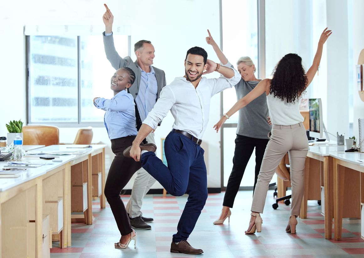 Group of office workers dancing