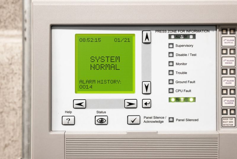 Fire panel of 4 story strata building with residential and commercial units. System is running normal, no errors displayed.
