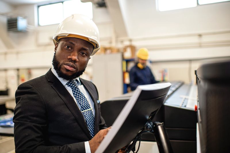 Factory manager ensuring all factory operations are running as they should be
