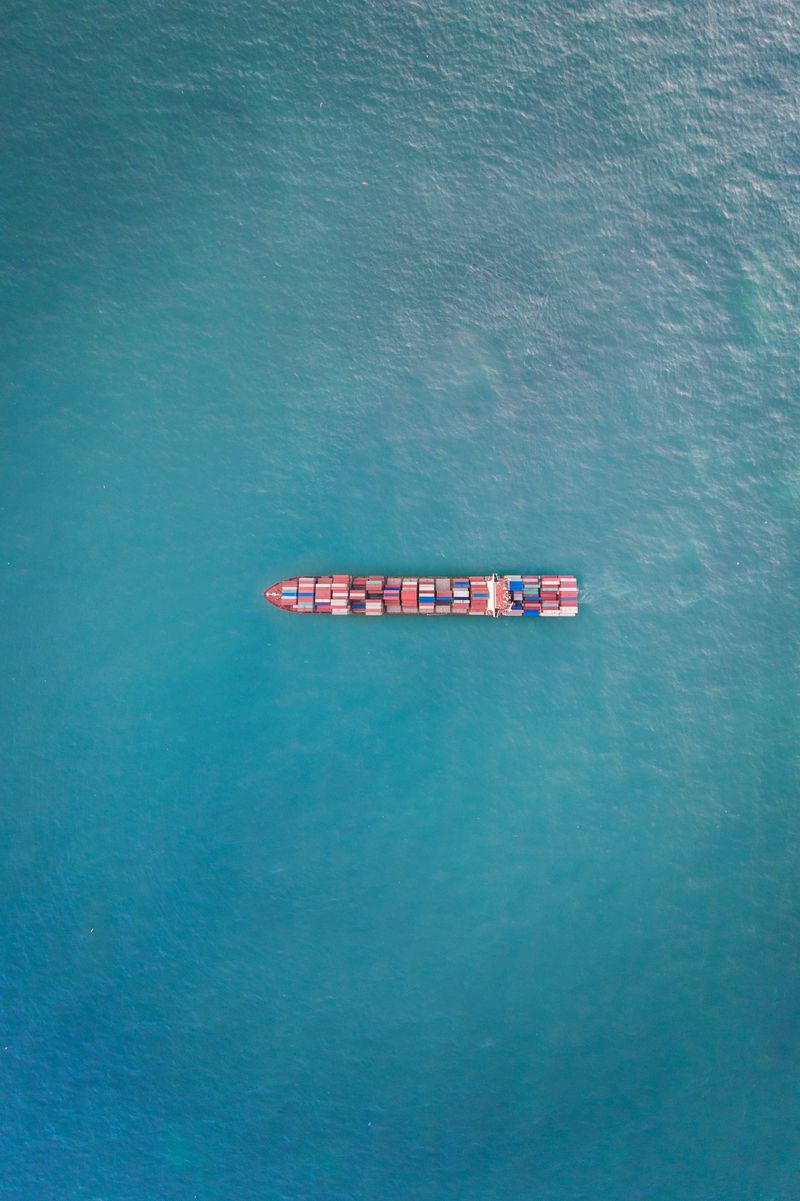 Aerial view of cargo container ship in transit.