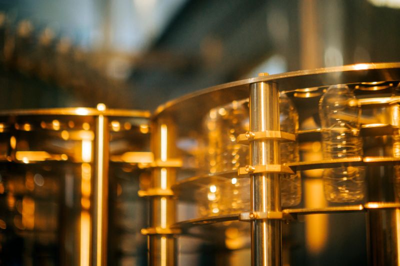 water Bottles spinning inside filling machine in mineral water drinking water factory