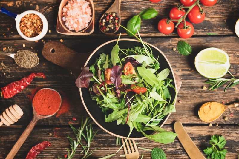 Fresh vegetables salad on wooden table