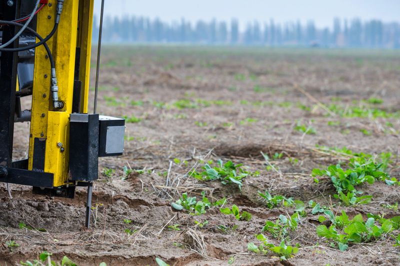 Soil Sampling - automated probe for soil samples taking sample with soil probe sampler. Precision agricultural technology advancing fast, detailed field information. Environmental protection, soil certification, research.