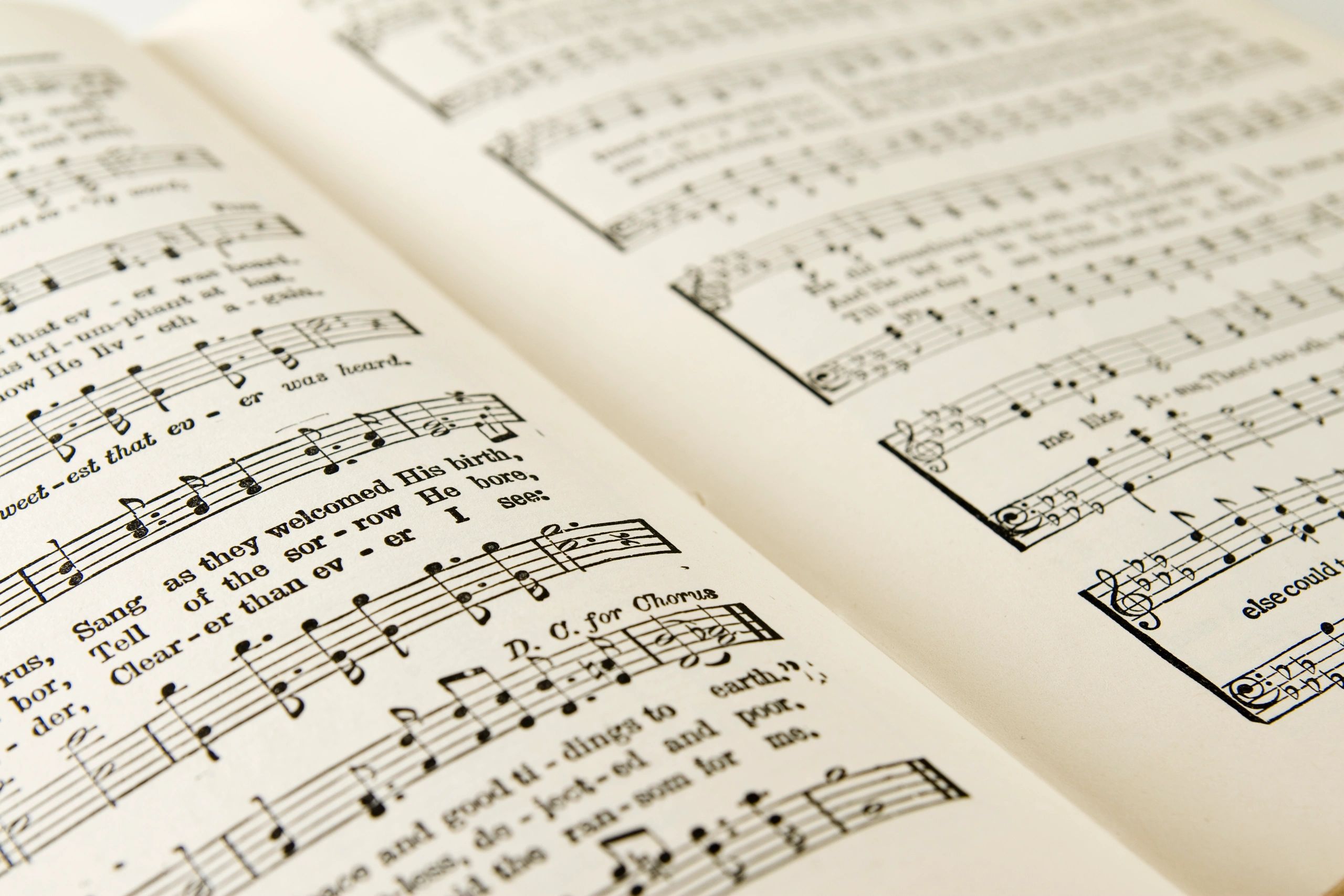 Music book open showing two pages.