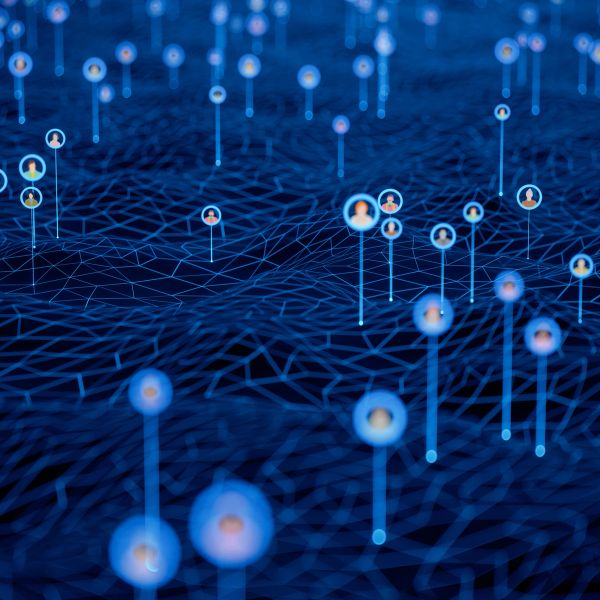 Digital network of connected user icons over a blue grid.