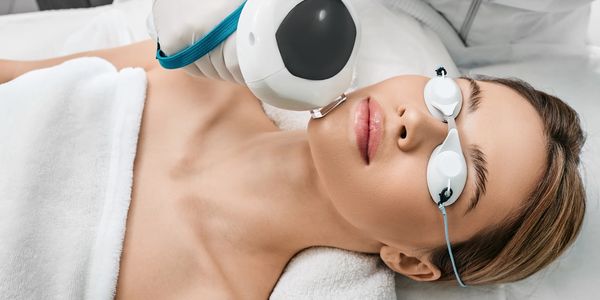Patient undergoing Lumecca IPL treatment for facial complexion improvement.