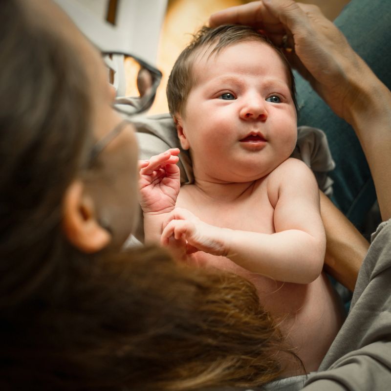 Beautiful newborn girl with mother