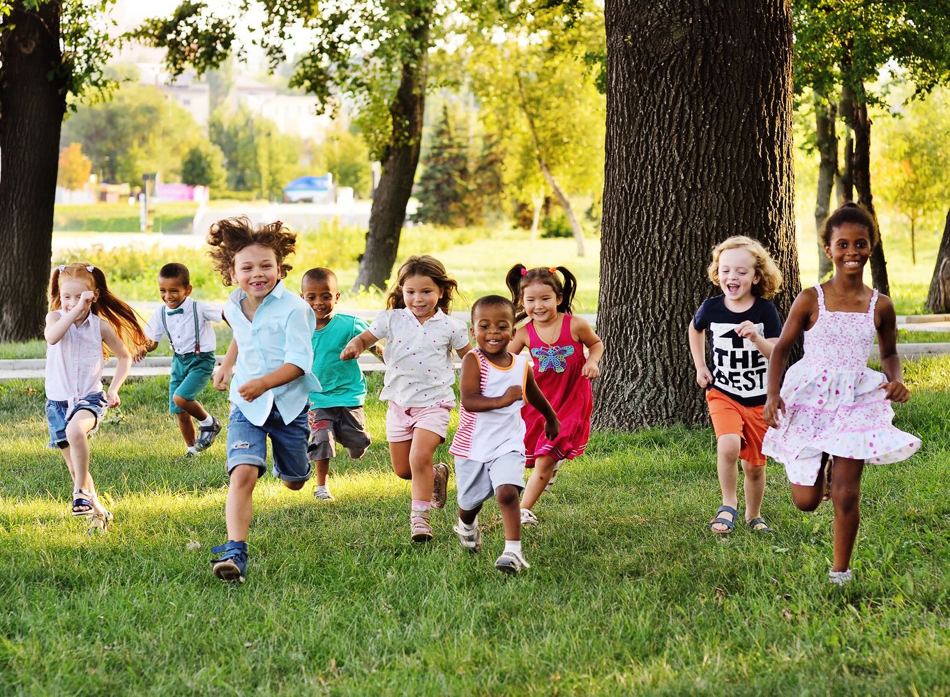 Group of children running and smiling 