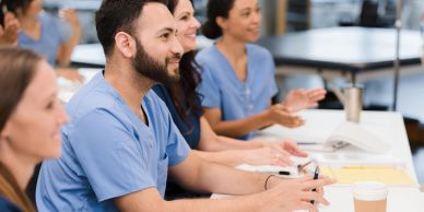 Group of medical professionals in training session.