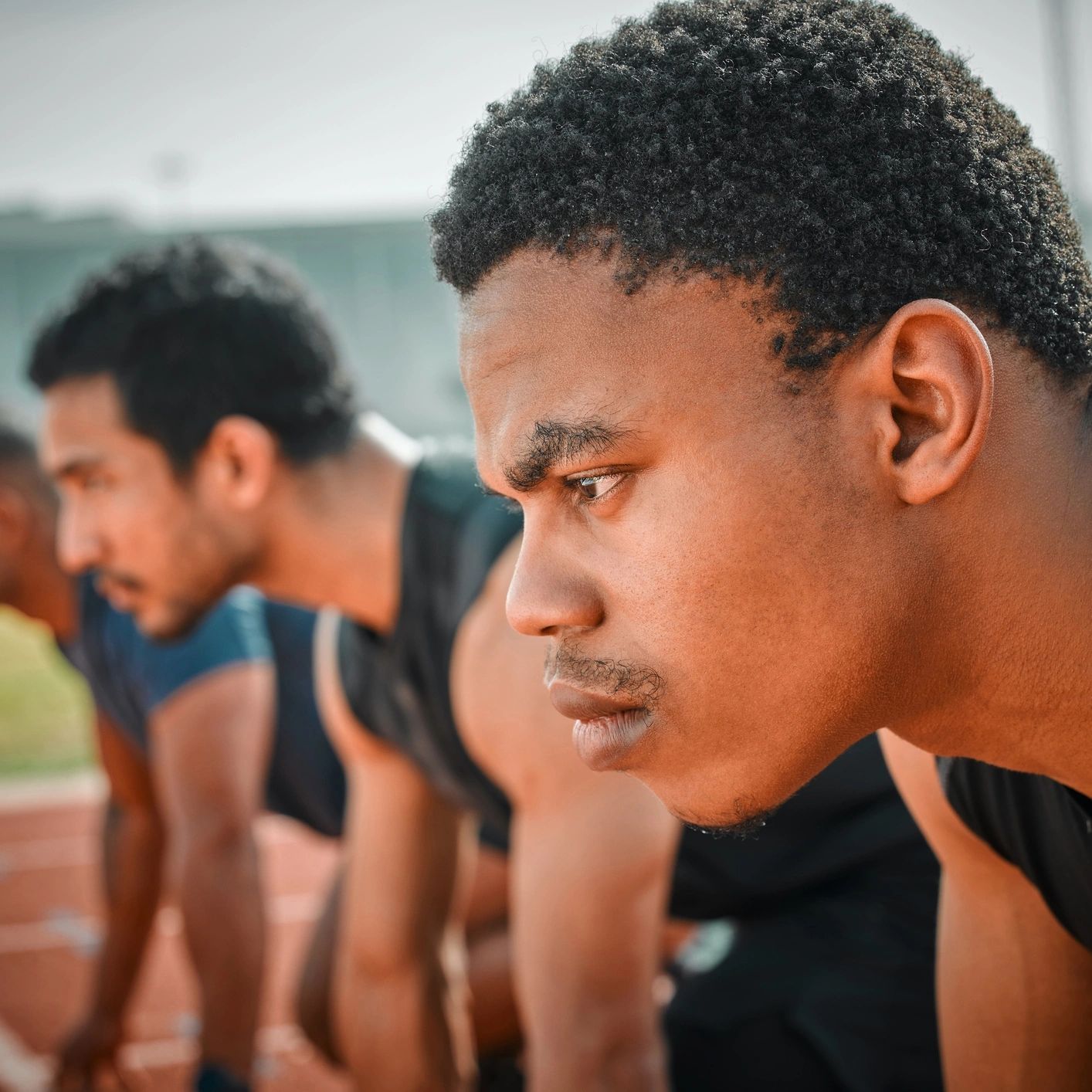 Sprinter in the starting blocks, focused and ready to race
