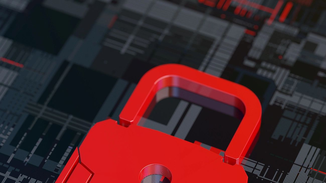 Red padlock on a digital circuit board symbolizing cybersecurity.