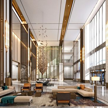 Luxurious hotel lobby with modern seating and artistic hanging sculpture.