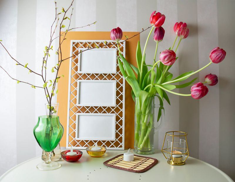 Spring still life, mockup, bouquet of tulips and photo frames, selective focus. High quality photo