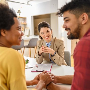 Homeowners discussing selling options with a direct real estate buyer