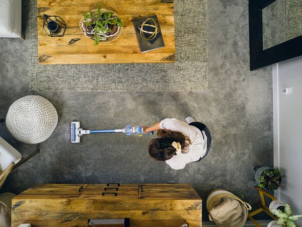 Woman mopping floor in office.