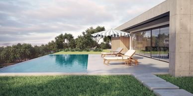 Modern house with a pool and sun loungers under a parasol.