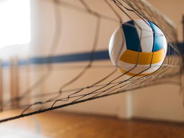 Volleyball caught in the net.