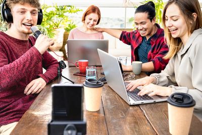 A team of people working while talking to each other.