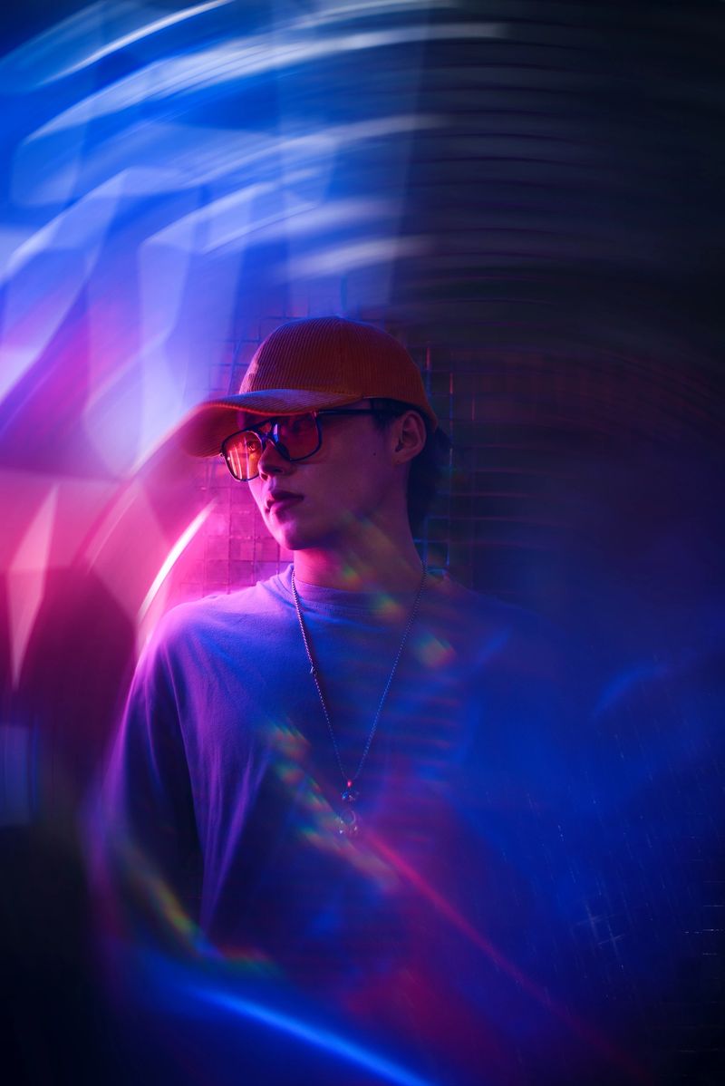 Asian male youth under neon lights