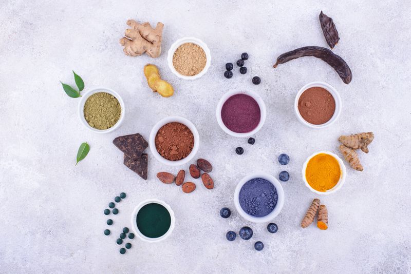 Various superfoods powder. Acai, matcha, spirulina, ginger, dried blueberry and turmeric