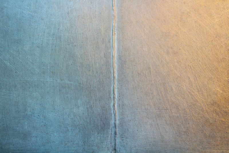 Old aluminum iron sheet. Weld. Close-up. Background. Texture.