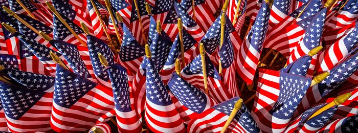 American flags proudly displayed from lamp posts on Main Street. 