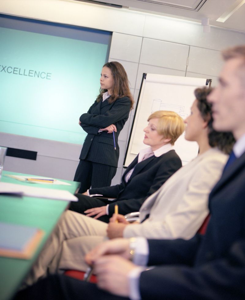 row of business people in a meeting.one falling asleep.shallow depth of field