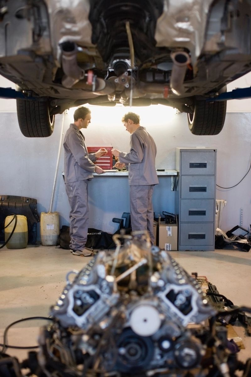 Mechanics working in garage