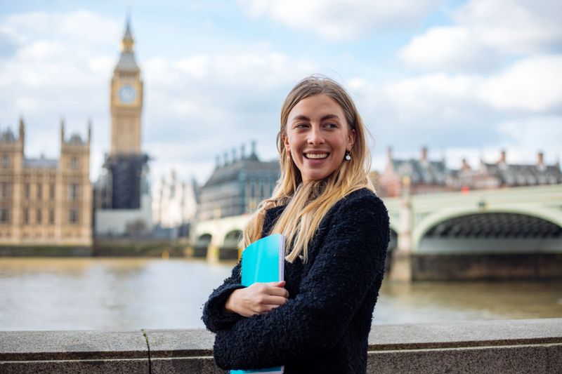 Happy female student in London