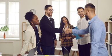 Business meeting handshake showcasing collaboration and professional web design services