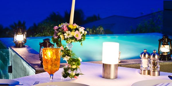Tropical beach wedding setup at sunset, ideal for destination weddings & romantic honeymoons.