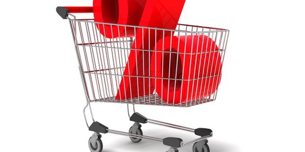 Shopping cart with a large red percentage symbol inside.