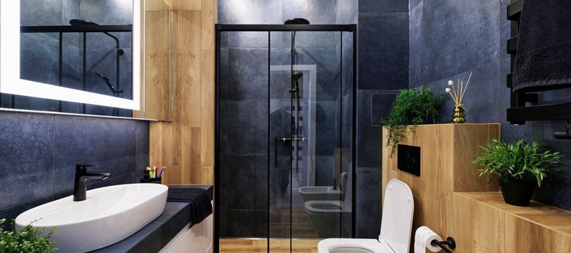 Remodeled bathroom with a bathtub and glass shower.
