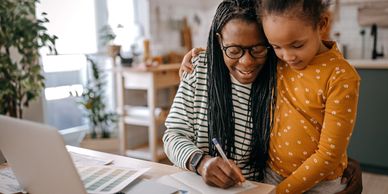 Parent at computer filling out form