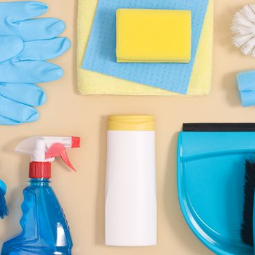 Assorted cleaning supplies including gloves, sponges, spray bottle, and dustpan.