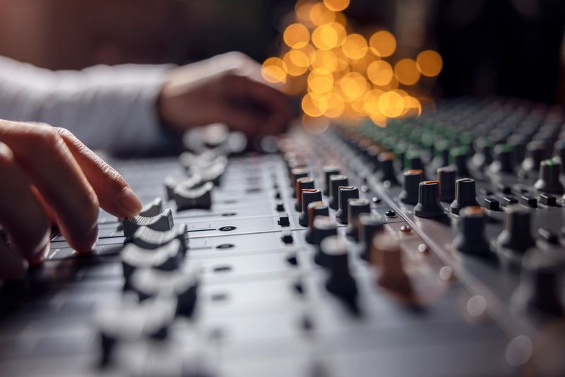 Sound recording studio mixing desk with engineer or music producer pov