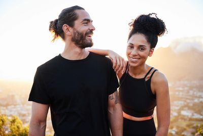 Happy couple enjoying a sunny outdoor moment together.