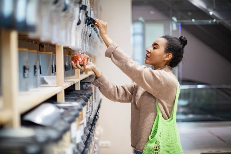 Woman buying food in zero waste shop