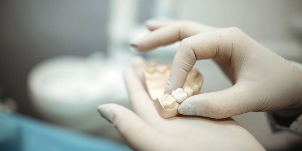 Dentist examining patient’s oral health in modern dental surgery