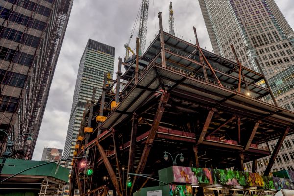 Steel structure of a building under construction in a city.